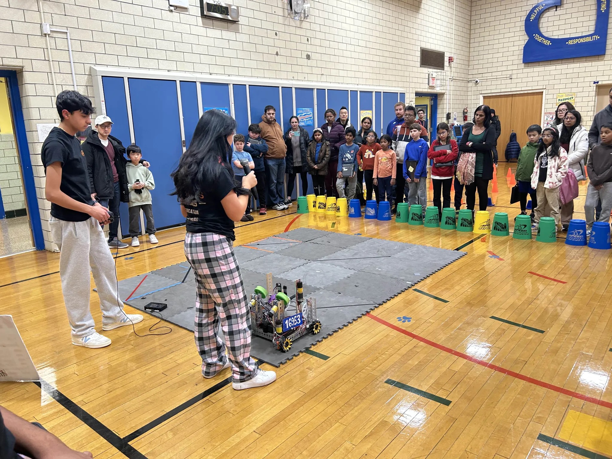 Fire Robotics demoing robot 16953 to students at an outreach event