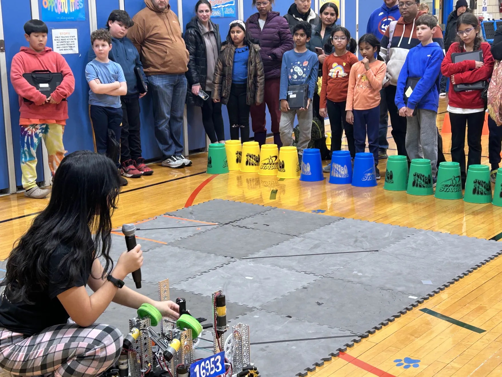 Fire Robotics presenting robot 16953 to students at an outreach event